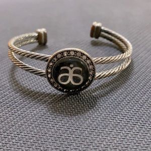 Arbonne logo cuff style bracelet.